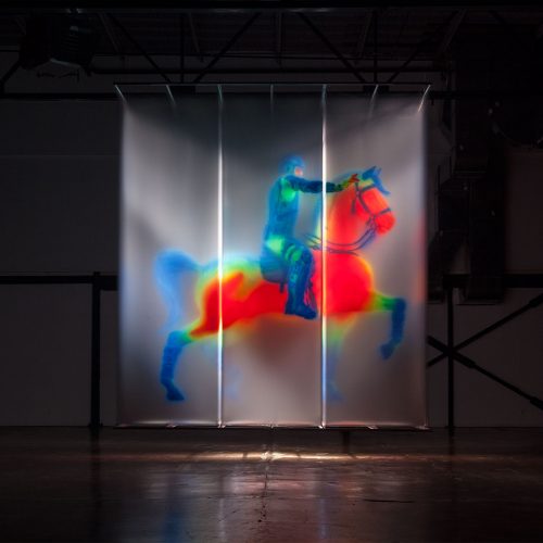 David Spriggs. Regisole - Sun King. 2015
Dimensions: 479 x 184 x 579 cm / 188.5 x 72.5 x 228 inches
3D installation artwork, acrylic spray paint on layers of transparent film, springs, t-bars, lighting. Digital modelling by Ian Spriggs.