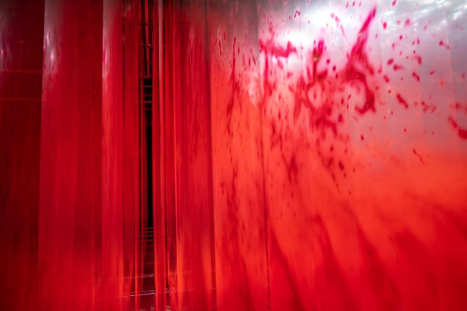 David Spriggs, First Wave, a monumental red wave painted across transparent layers